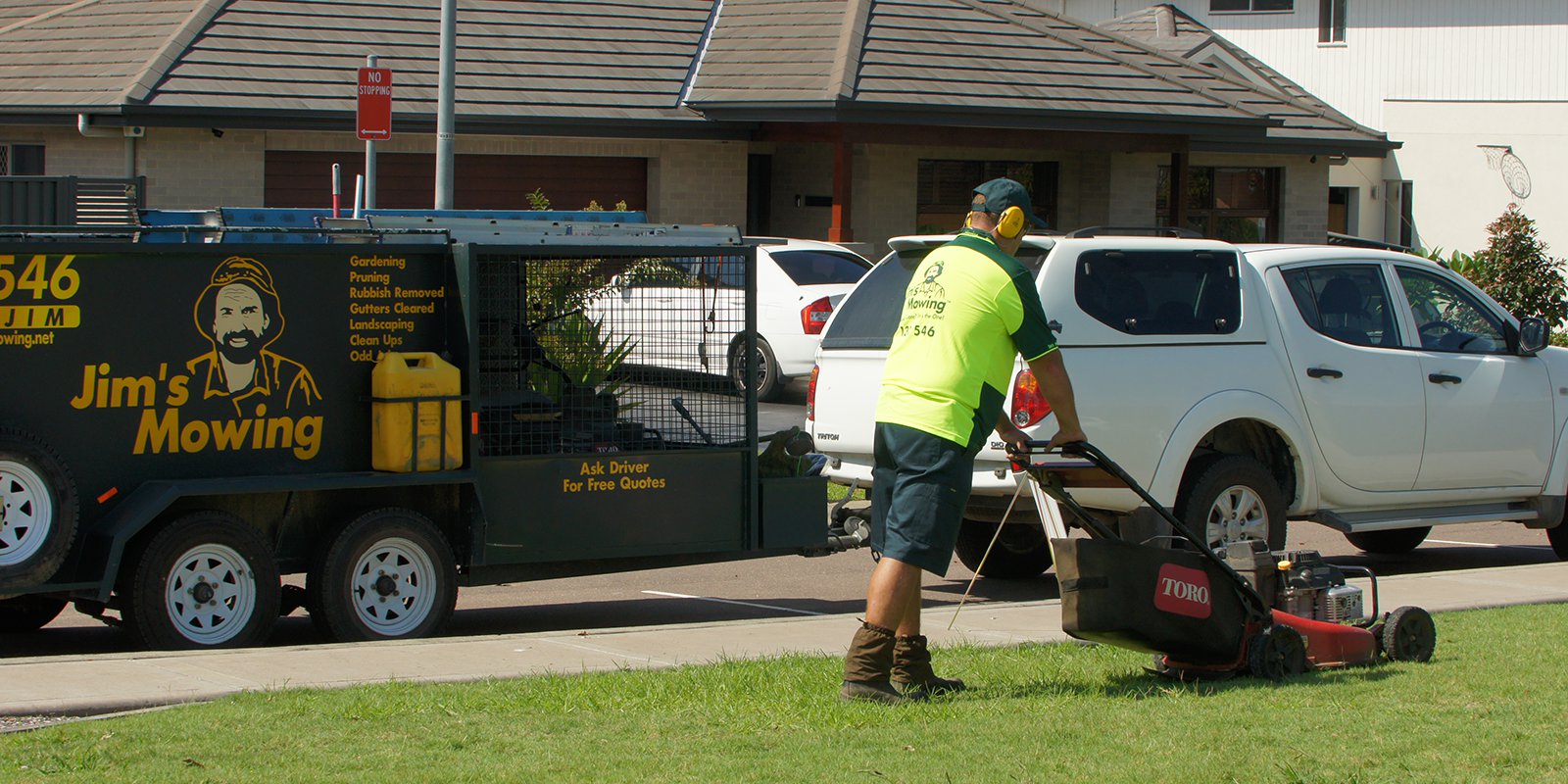 Your local Jim's franchisee mowing a front lawn